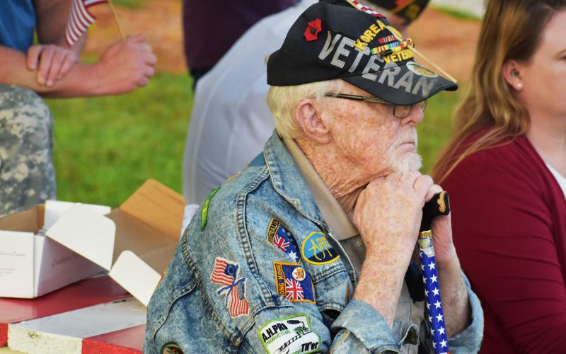 Korean War veteran Capt. Bill Morgan listens intently to the presentation at the Wall of Honor on Saturday. MATTHEW OSBORNE/Staff
