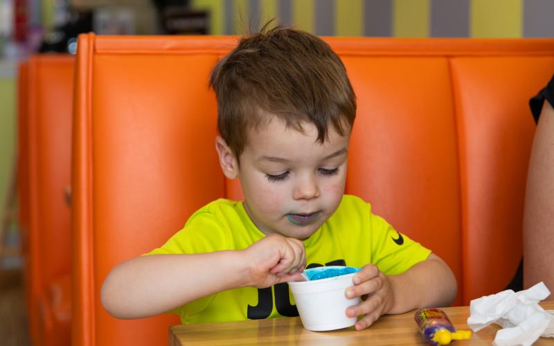 Tommy Howard enjoys his Cookie Monster ice cream at Scoops in Clarkesville. ZACH TAYLOR/Special