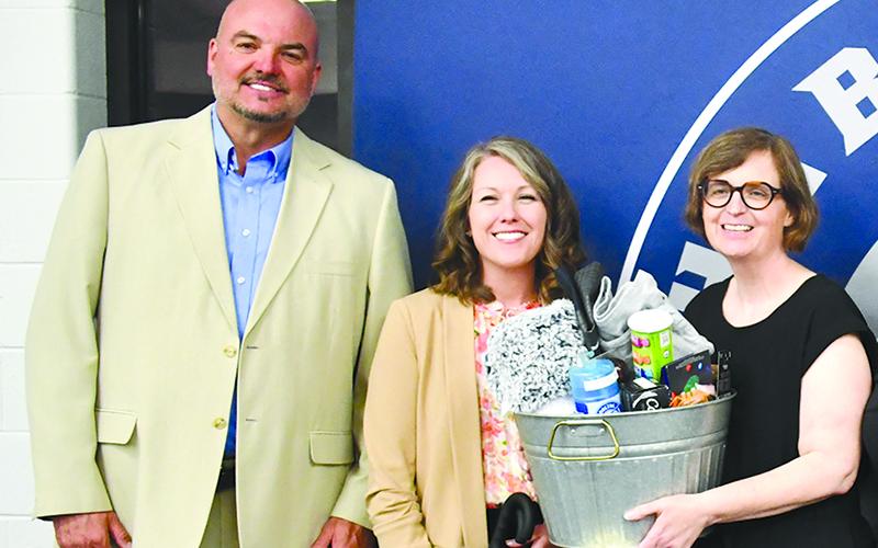 Shown (from left) are Superintendent Matthew Cooper, new North Habersham Middle School Principal Renee Crandall, North Hab Teacher of the Year Tiffany Collins at a banquet earlier this year. JULIANNE AKERS/File